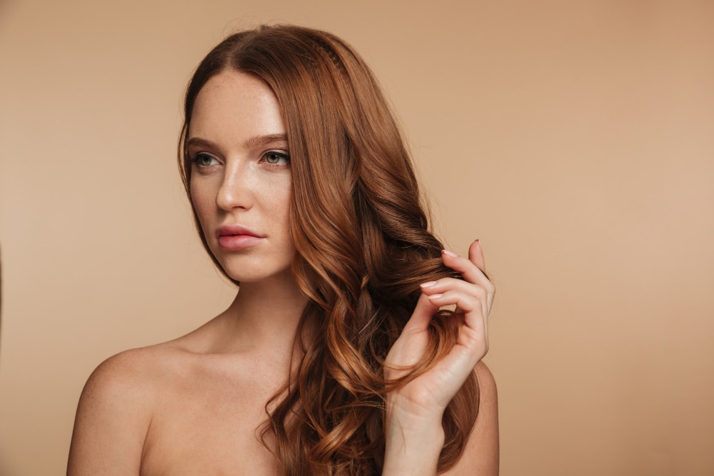 beauty portrait pretty ginger woman with long hair posing looking away