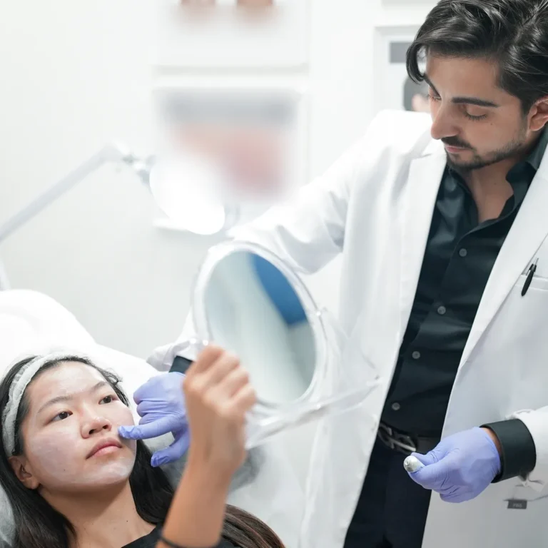 4D practitioner reviewing a client's skin during a consultation at 4D Skin Care Clinic, North Vancouver