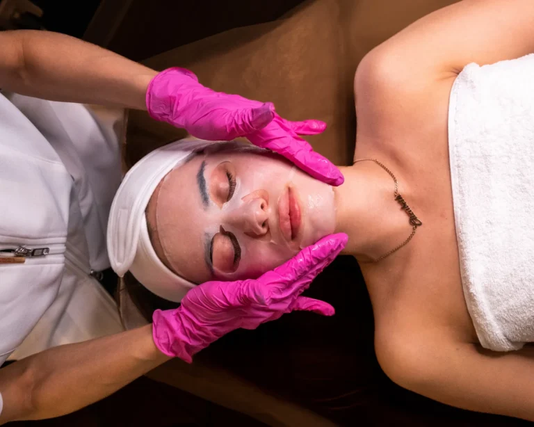 Client relaxing during a facial at 4D Skin Care Clinic in North Vancouver